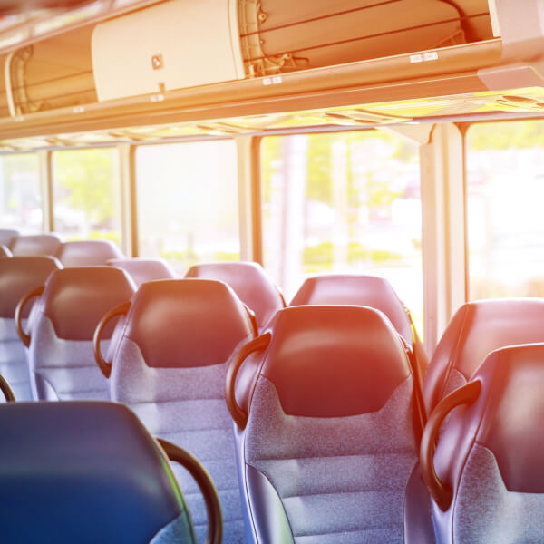 blue seat in interior of coach seats in tourist bus