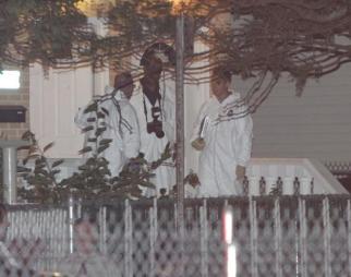 Investigators at the scene of Sunday's shooting in Queens.