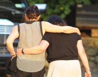 Mourners look to one another for support at Wednesday's wake for actor James Gandolfini.