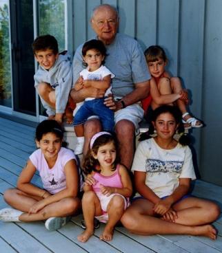 FAMILY:</p>
<p>Koch sits with “his kids” (rear from l.) Noah, Perri and Hannah and (front from l.) Jordan, Sasha and Kayla in ’02.” /></p>
<p class=