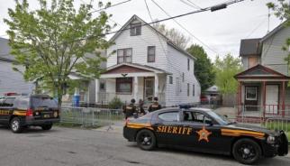 HELL HOUSE: The Cleveland home where the three women were kept and sadistically abused for years, until they were freed by rescuers May 7. Neighbors kicked in parts of the front door to get to the captives.