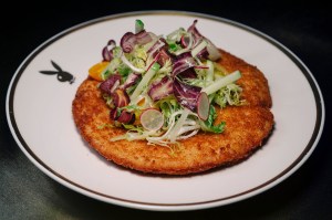 The club's food offerings include chicken milanese.