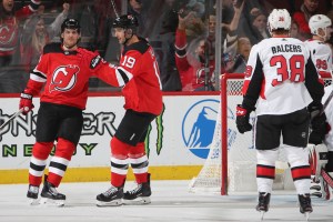 Travis Zajac (19) celebrates after scoring a goal. 