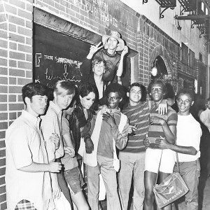 A group of young people celebrate outside the boarded-up Stonewall Inn after riots over the weekend of June 27, 1969.