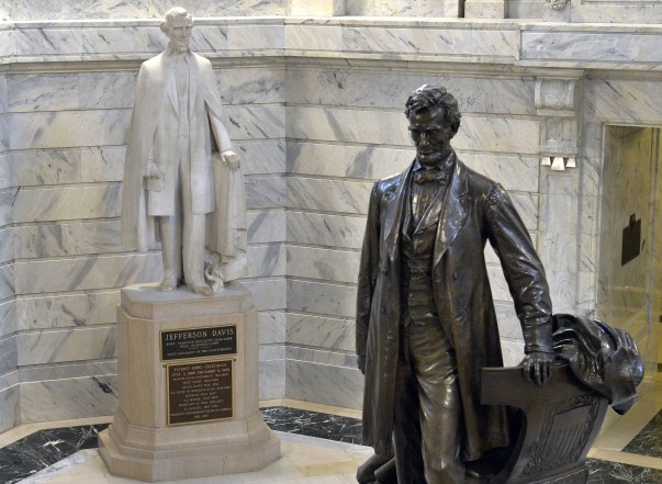 Workers prepare to remove the Jefferson Davis statue from the Kentucky state Capitol in Frankfort, Ky., Friday, June 12, 2020