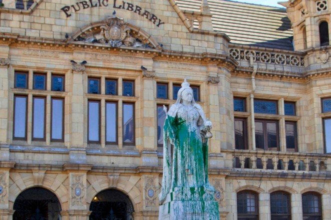 A statue of Britain's Queen Victoria stands outside the Port Elizabeth city library, South Africa after being splashed with green paint.