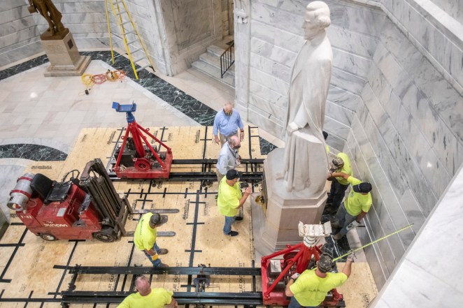 Workers prepare to remove the Jefferson Davis statue from the Kentucky state Capitol in Frankfort, Ky., Friday, June 12, 2020