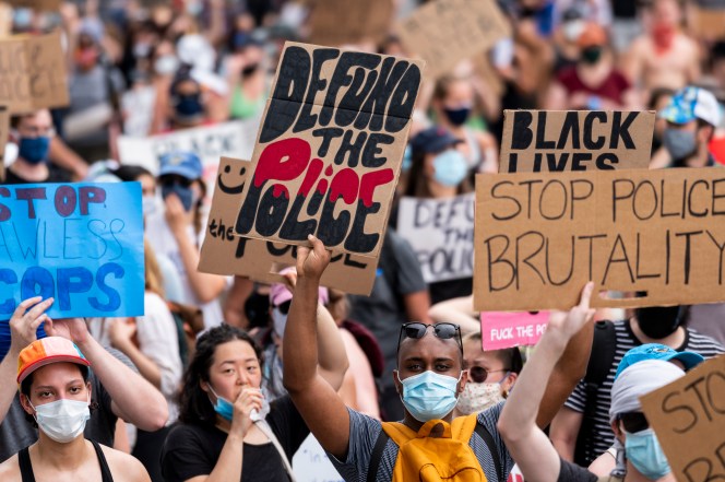 Protesters march down Pennsylavania Avenue from the Capitol as George Floyd police brutality demonstrations and marches are held around Washington