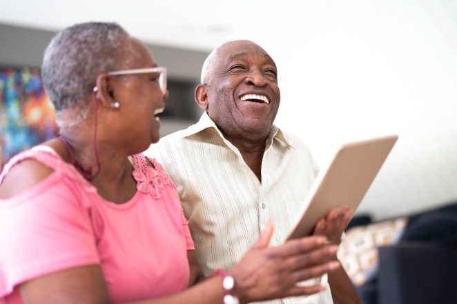 Senior couple using digital tablet