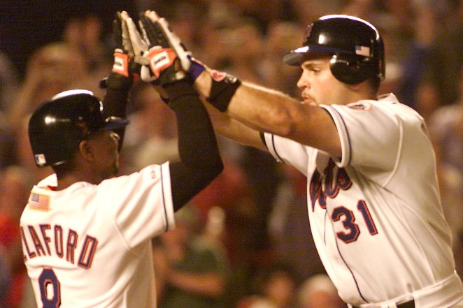 Mike Piazza celebrates his home run with teammate Desi Relaford