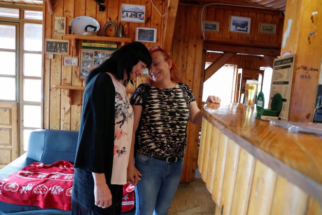 Hungarian transgender couple Elvira Angyal and Tamara Csillag waits in a pub in Polgardi, Hungary.