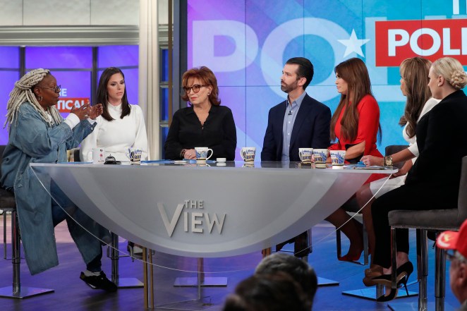 Donald Trump Jr. and Kimberly Guilfoyle listen as Whoopi Goldberg speaks on "The View."