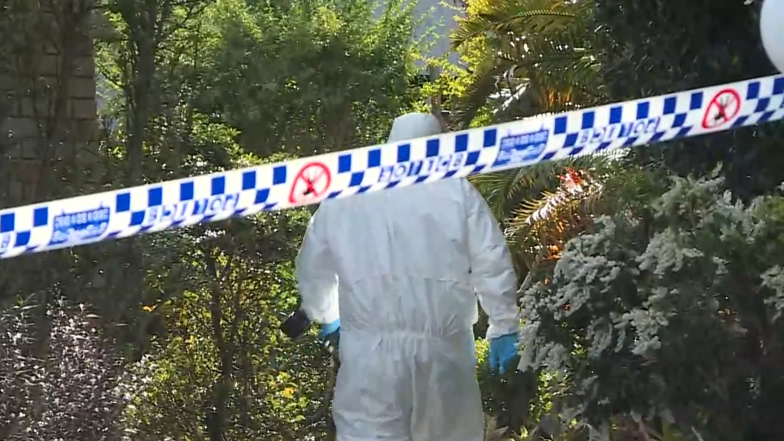 Woman charged with murder after man's body found inside surfboard bag