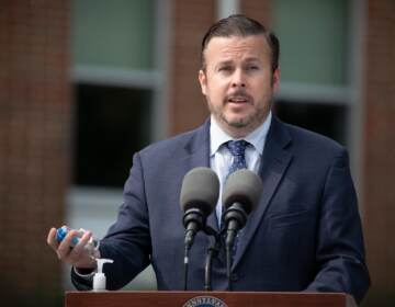 State Rep. Kevin Boyle stands behind a podium