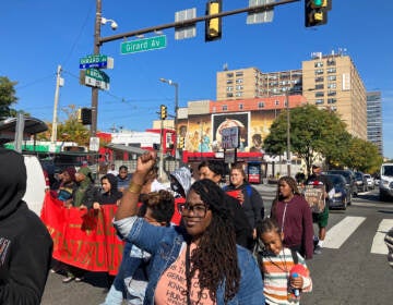 Rahnda Rize, Philadelphia activist and performing artist, participates in the Million Kid March from North Philadelphia to City Hall on Oct. 15.(Sammy Caiola/WHYY)