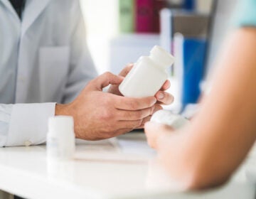 Doctor consulting patient about right medication.