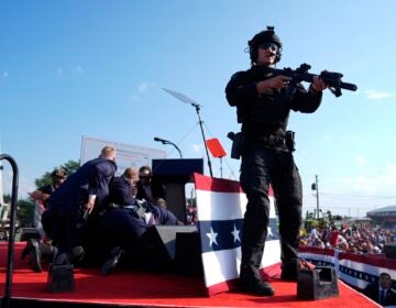 Secret Service with Trump after the shooting at his rally