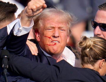 FILE - Republican presidential candidate former President Donald Trump reacts following an assassination attempt at a campaign event in Butler, Pa., on Saturday, July 13, 2024. Trump Media surged in the first day of trading, Monday, July 15, following the assassination attempt. (AP Photo/Gene J. Puskar, File)