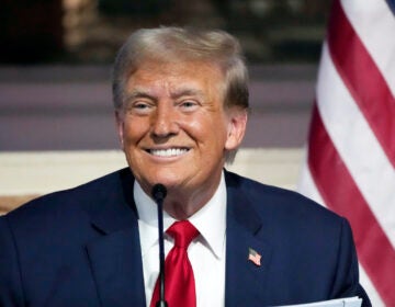 Donald Trump smiling intensely