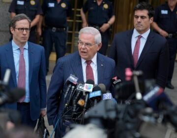 Sen. Bob Menendez, D-N.J., center, speaks to reporters as he leaves federal court in New York, Tuesday, July 16, 2024.