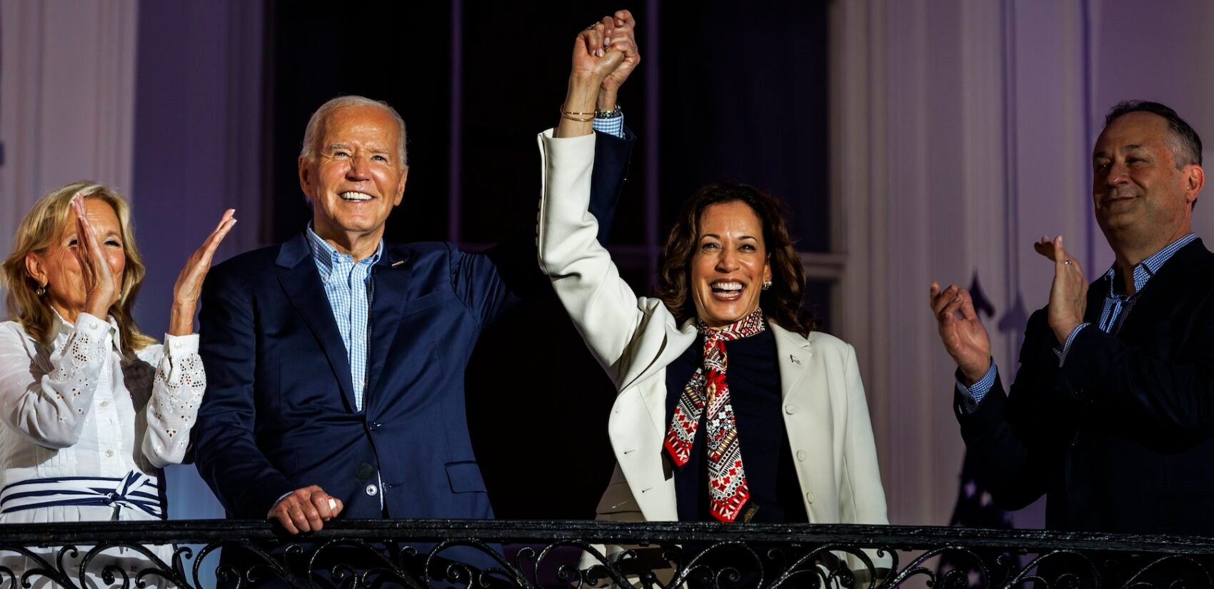 Biden and Harris raising their fists