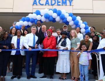 People gathered to cut the ribbon