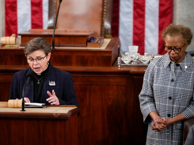 House Chaplain retired Rear Adm. Margaret Kibben offers a prayer as Clerk of the House of the Representatives Cheryl Johnson bows her head in the House chamber as the House meets for the fourth day to elect a speaker and convene the 118th Congress in Washington, Friday, Jan. 6, 2023. (AP Photo/Andrew Harnik)