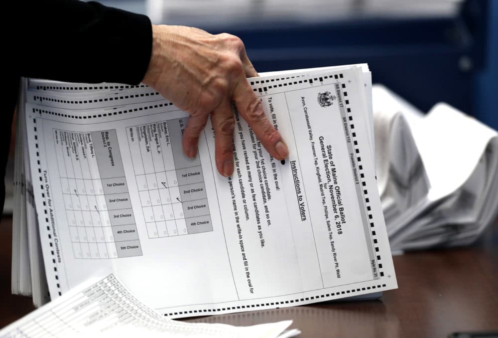 Ballots are prepared to be tabulated during a 2018 election in Augusta, Maine. The election was the first congressional race in American history to be decided by the ranked-choice voting method that allows second choices. (Robert F. Bukaty/AP)