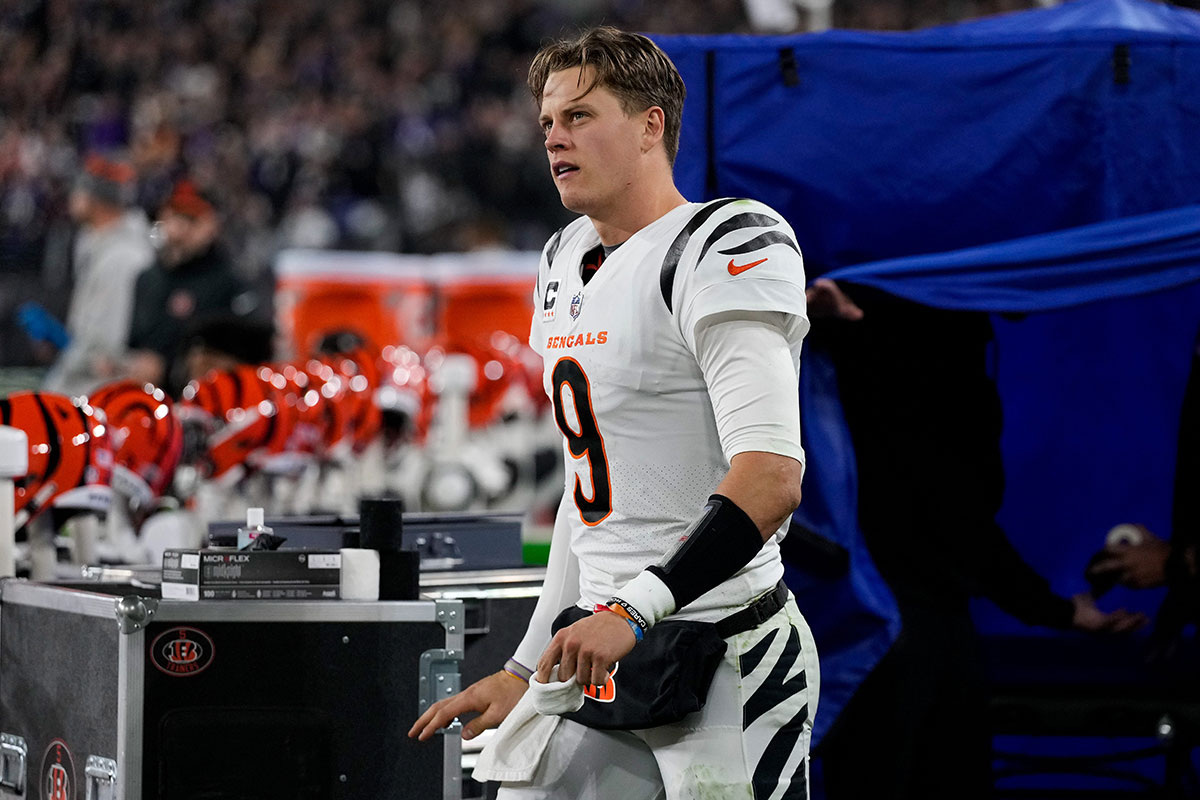 Cincinnati Bengals quarterback Joe Burrow (9) emerges from the examination tent before running to the locker room with an apparent hand injury in the second quarter of the NFL Week 11 game between the Baltimore Ravens and the Cincinnati Bengals at M&T Bank Stadium in Baltimore on Thursday, Nov. 16, 2023.