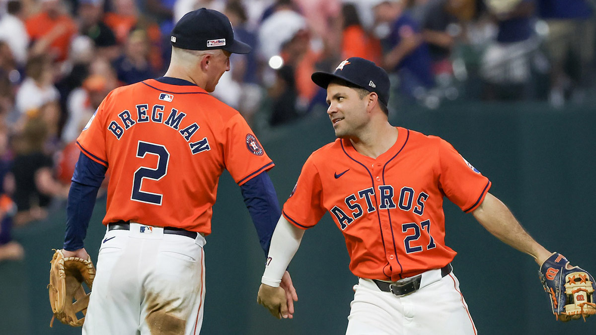 Houston Astros third baseman Alex Bregman (2) and second baseman Jose Altuve (27) celebrate the win against the Detroit Tigers at Minute Maid Park.