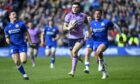 Blair Kinghorn strides through for his third try of the match.