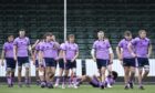 Scotland Under-20 players after their 40-17 defeat to Italy at Scotstoun on  Sunday.