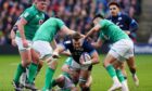 Jack Dempsey is tackled by Jonny Sexton during the clash at Murrayfield.