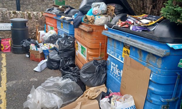 To go with story by Michael Alexander. Fife Council safer communities officers Picture shows; Overflowing bins and illegal fly tipping at Bonnygate car park, Cupar. Cupar. Supplied by Michael Alexander Date; 28/05/2024