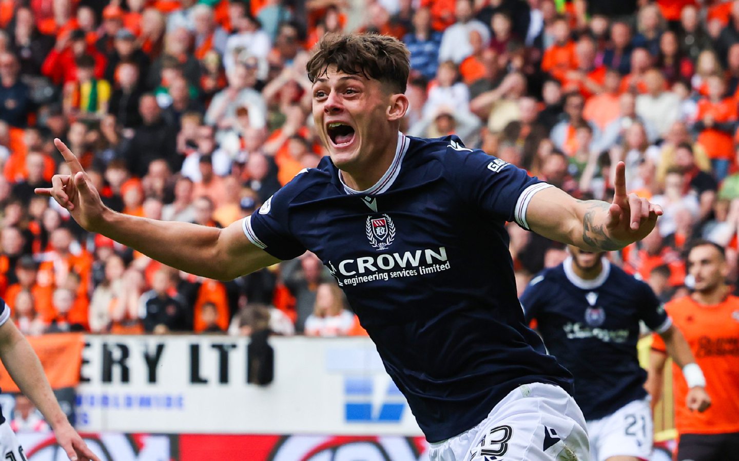 Seb Palmer-Houlden celebrates his goal in the Dundee derby at Tannadice. Image: SNS