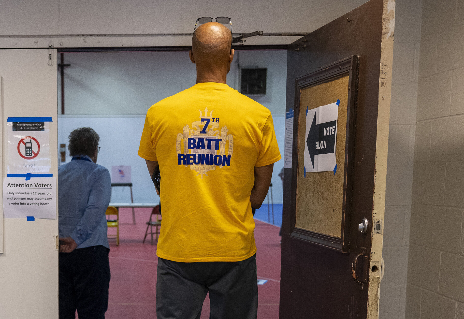 man waiting to vote