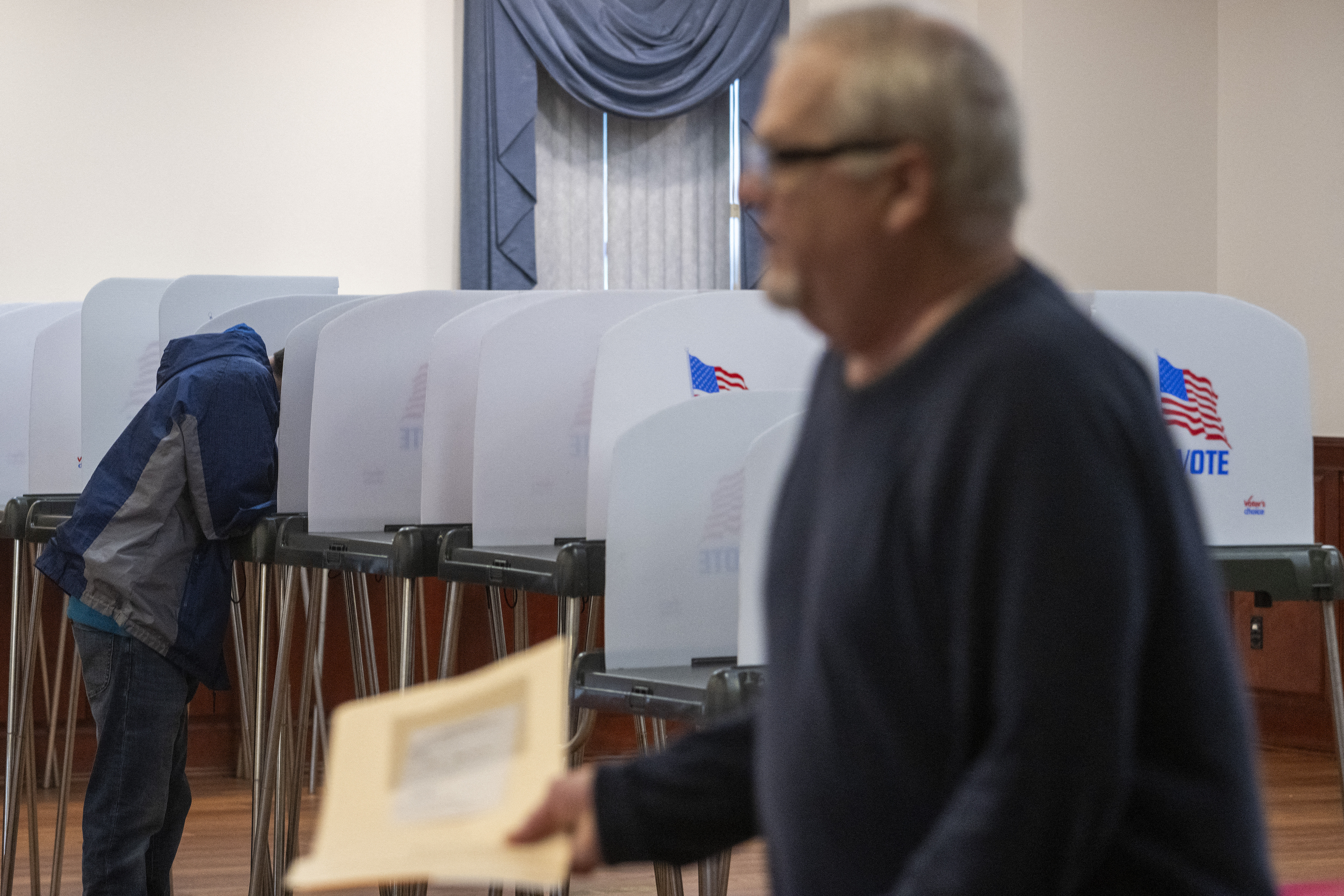 man in voting center
