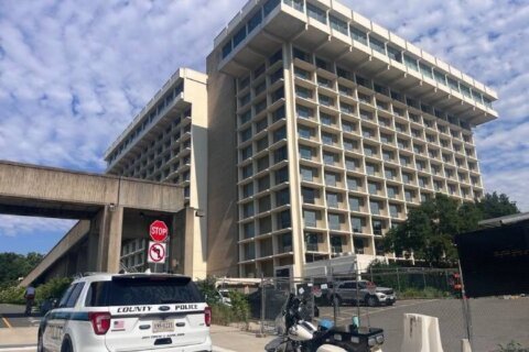 No wrecking ball yet — but Arlington Co. begins boarding up vacant Key Bridge Marriott