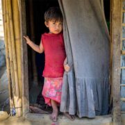 Girl stands in doorway