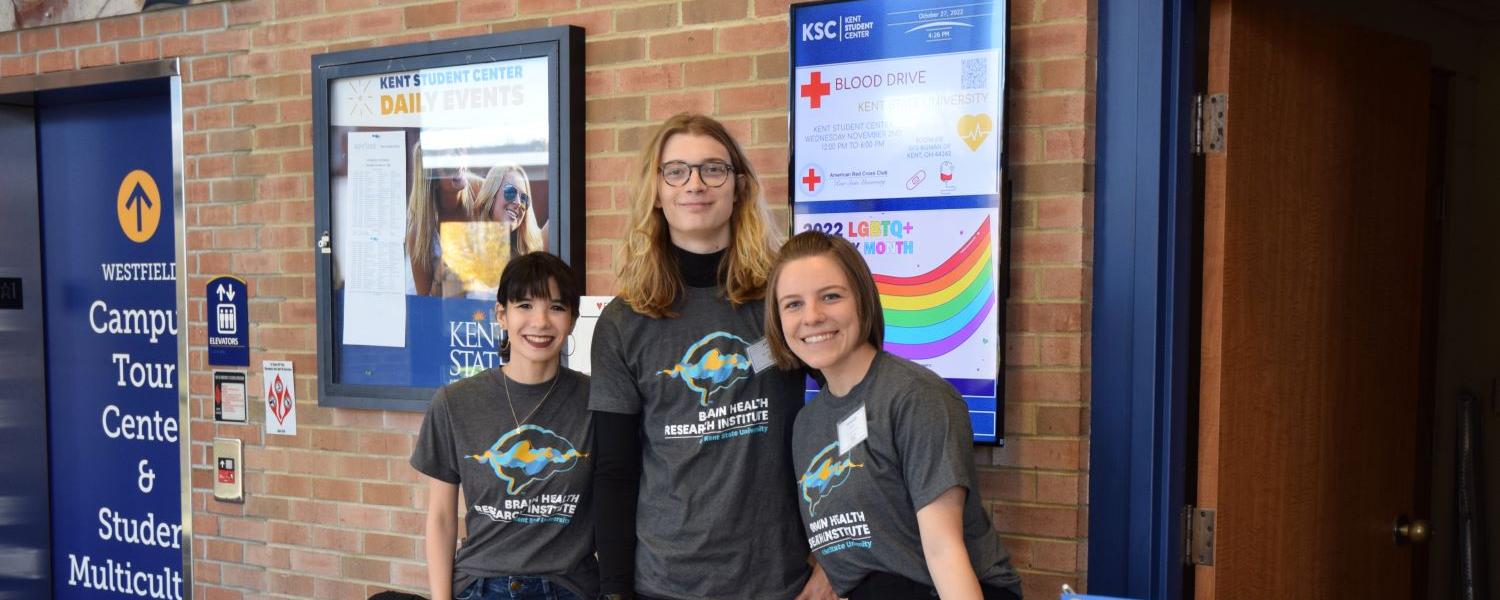 Student volunteers checked in guests at the 10th Annual Brain Health Research Symposium, and distributed programs. 