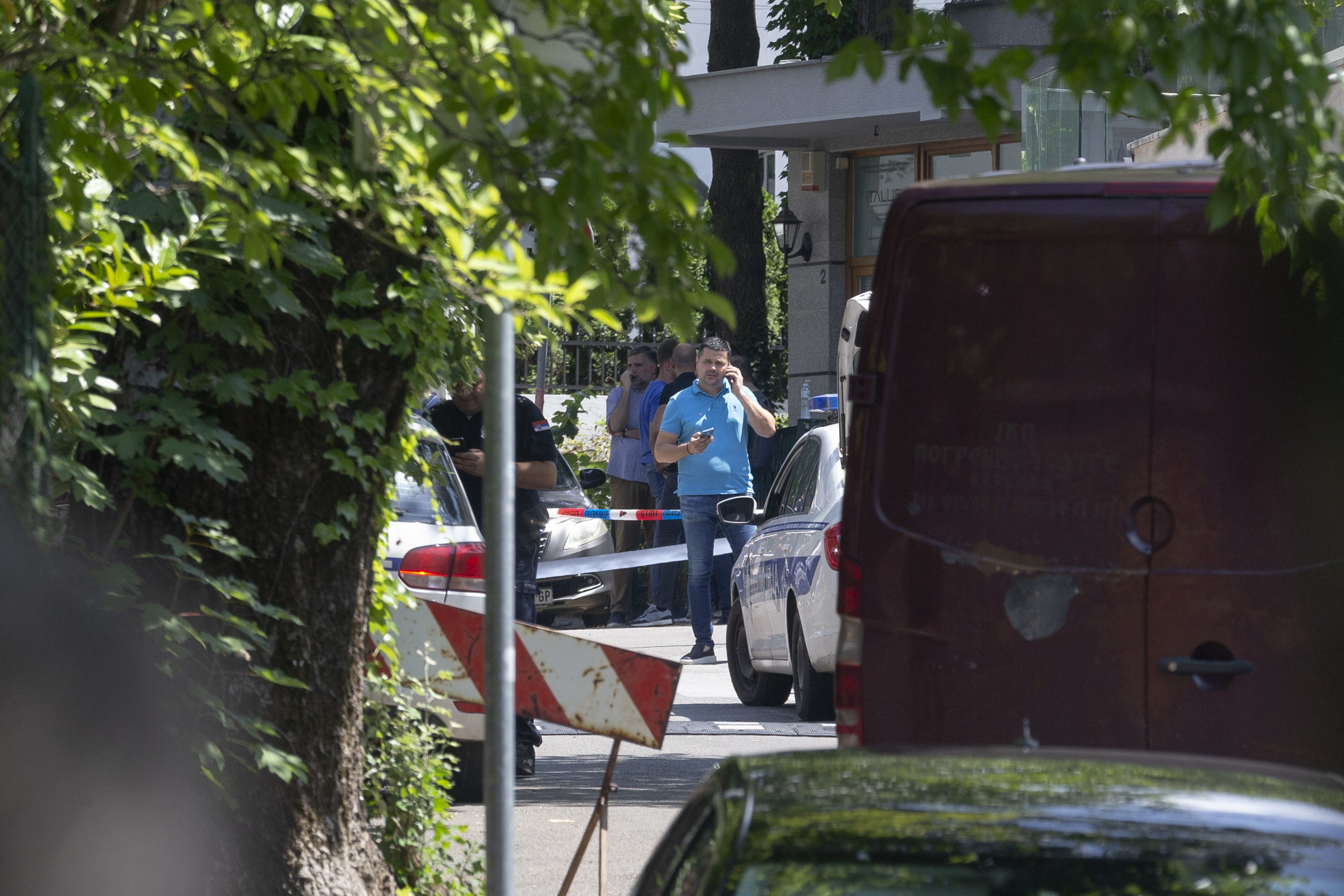 Police officers work at a crime scene close to the Israeli embassy in Belgrade, Serbia, Saturday, June 29, 2024. An attacker with a crossbow wounded a Serbian police officer guarding the Israeli Embassy in Belgrade. Serbia’s interior ministry says the officer responded by fatally shooting the assailant. (AP Photo/Marko Drobnjakovic)