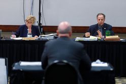 North Dakota Public Service Commission Chair Randy Christmann, right, asks questions April 22, 2024, during a public hearing on the Summit Carbon Solutions pipeline. At left is Commissioner Sheri Haugen-Hoffart