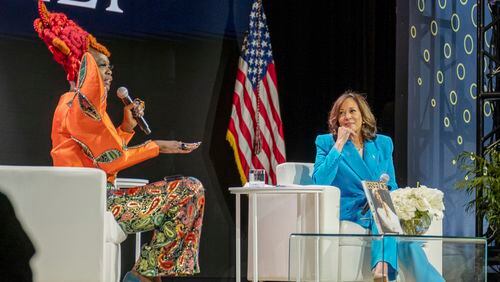 Vice President Kamala Harris (right) listens as Essence CEO Caroline Wanga speaks during the Essence Festival of Culture in New Orleans on Saturday.