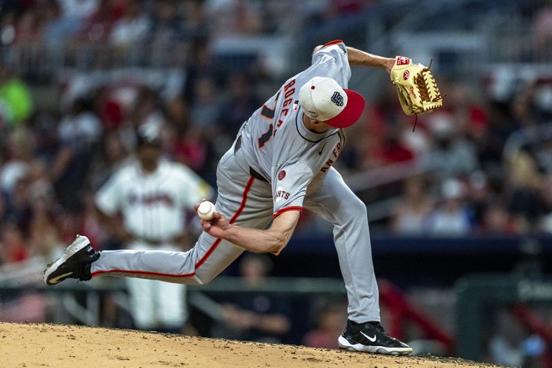 San Francisco Giants pitcher Camilo Doval throws during the ninth inning of a baseball game against the Atlanta Braves, Thursday, July 4, 2024, in Atlanta. (AP Photo/Jason Allen)
