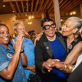 Former Commissioner Lorraine Cochran-Johnson  (second from right) will be the next chief executive officer of DeKalb County.