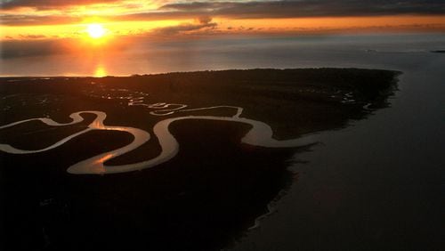 The early morning sun breaks through the clouds over Ossabaw Island, Ga., on Friday, Nov. 17, 2006. CURTIS COMPTON / THE ATLANTA JOURNAL-CONSTITUTION