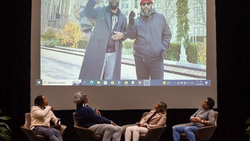 On screen, the AJC’s Ryon Horne (left) and Tyson Horne deliver a prerecorded message to viewers following a screening of their film, the AJC's hip-hop documentary "The South Got Something to Say,” at the Atlanta University Center Robert W. Woodruff Library on Thursday, Nov. 30, 2023. The panel onstage is the Maroon Tiger's Auzzy Byrdsell (from left) and AJC staffers Ernie Suggs, DeAsia Paige and Mike Jordan.
Bita Honarvar for The Atlanta Journal-Constitution