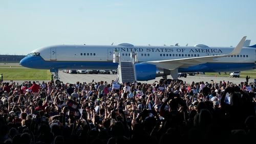 Air Force Two with Democratic presidential nominee Vice President Kamala Harris and her running mate Minnesota Gov. Tim Walz aboard arrive for a campaign rally Wednesday, Aug. 7, 2024, in Romulus, Mich. (AP Photo/Carlos Osorio)