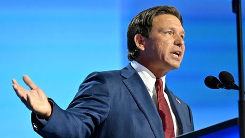 Florida Gov. Ron DeSantis, who spoke Friday at The Gathering, an annual conservative conference that commentator Erick Erickson puts on, said voters will see through the "shtick" of Democratic vice presidential candidate Tim Walz. “He’ll say things like, ‘Well, these Republicans are weird,’ " DeSantis said of the Minnesota governor. "This is a guy that used Minnesota tax dollars to put tampons in the boys bathrooms.” (Hyosub Shin / AJC)