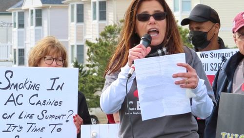 Nicole Vitola, a dealer at the Borgata casino, speaks at a rally in Atlantic City, N.J. on April 12, 2022, calling on state lawmakers to ban smoking in the gambling halls. (AP Photo/Wayne Parry)